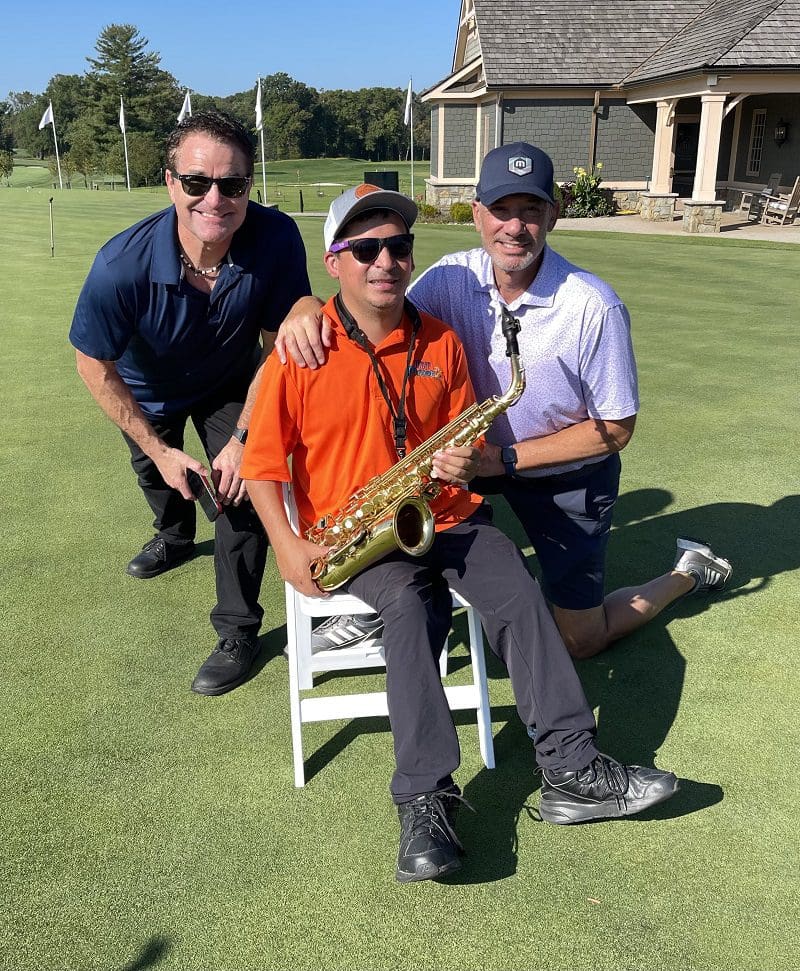 David Godoy with musicians at Woodmont Country Club at the 2023 Main Street Golf Outing