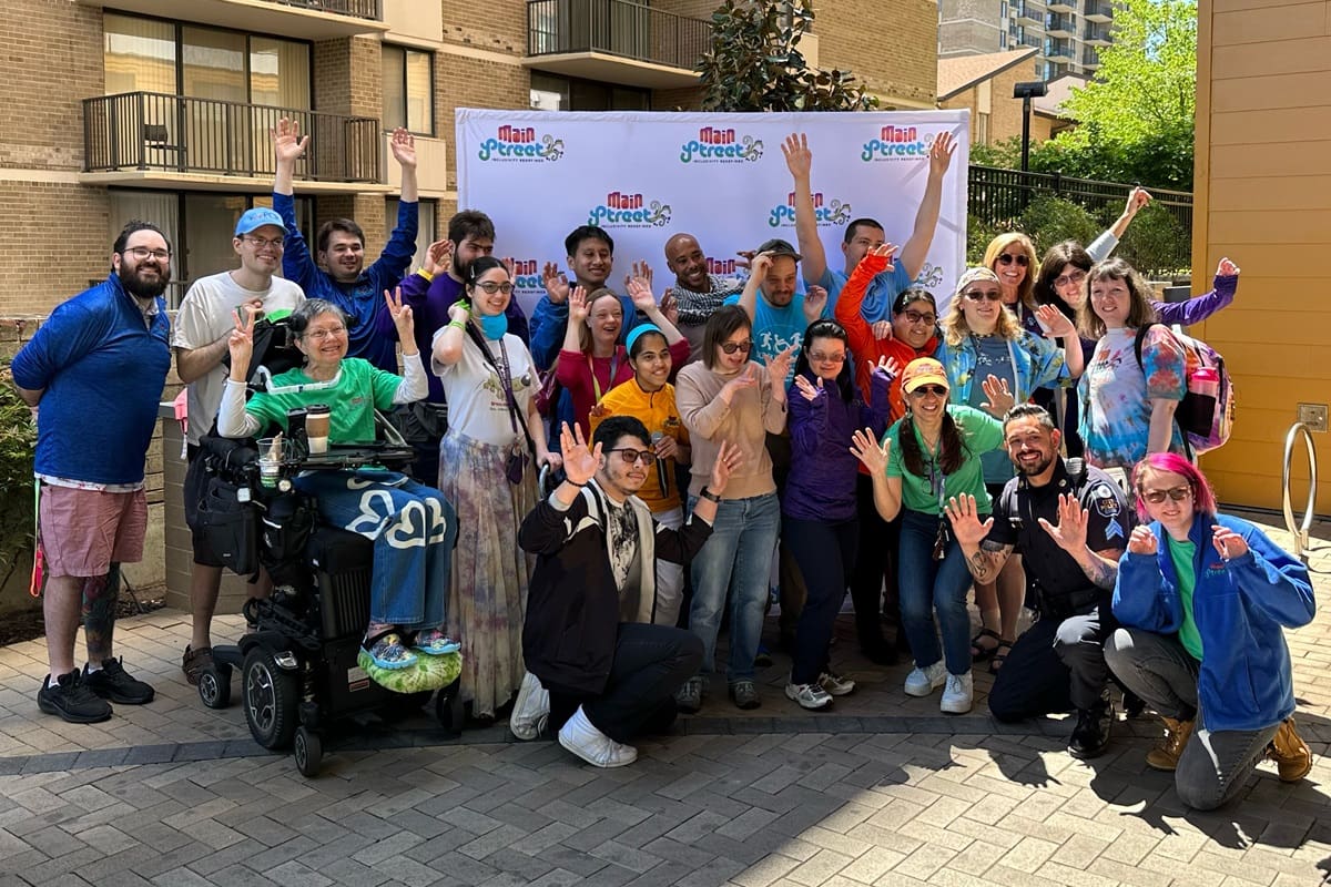 Large group smiling in front of Main Street building during Springfest 2023