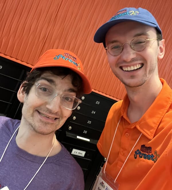 Robert and Main Street ambassador wearing Main Street shirts and hats